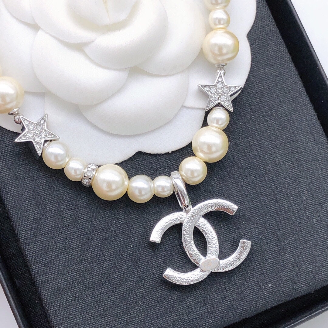 Martin Graham pendant necklace in polished metal-tone – close-up detail