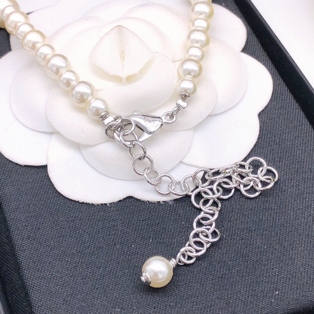 Martin Graham pendant necklace in polished metal-tone – front product view