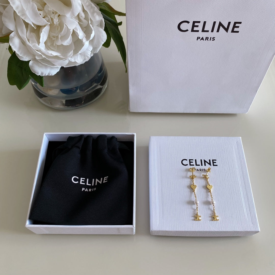 Martin Graham earrings in polished metal-tone