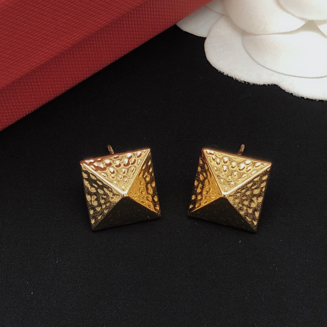Martin Graham stud earrings in polished metal-tone – front view