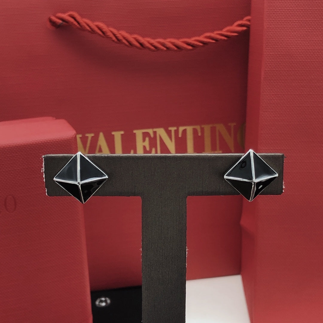 Martin Graham stud earrings in polished metal-tone