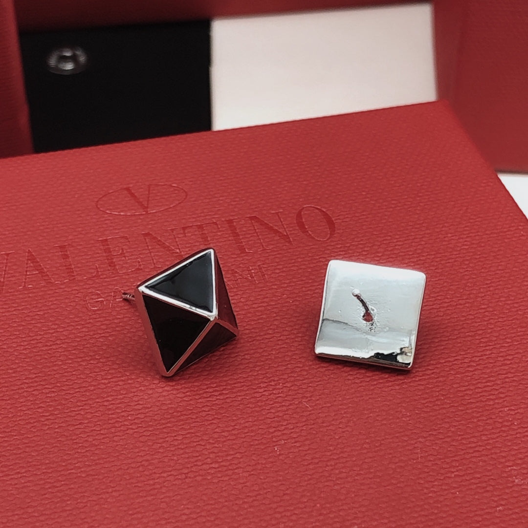 Martin Graham stud earrings in polished metal-tone
