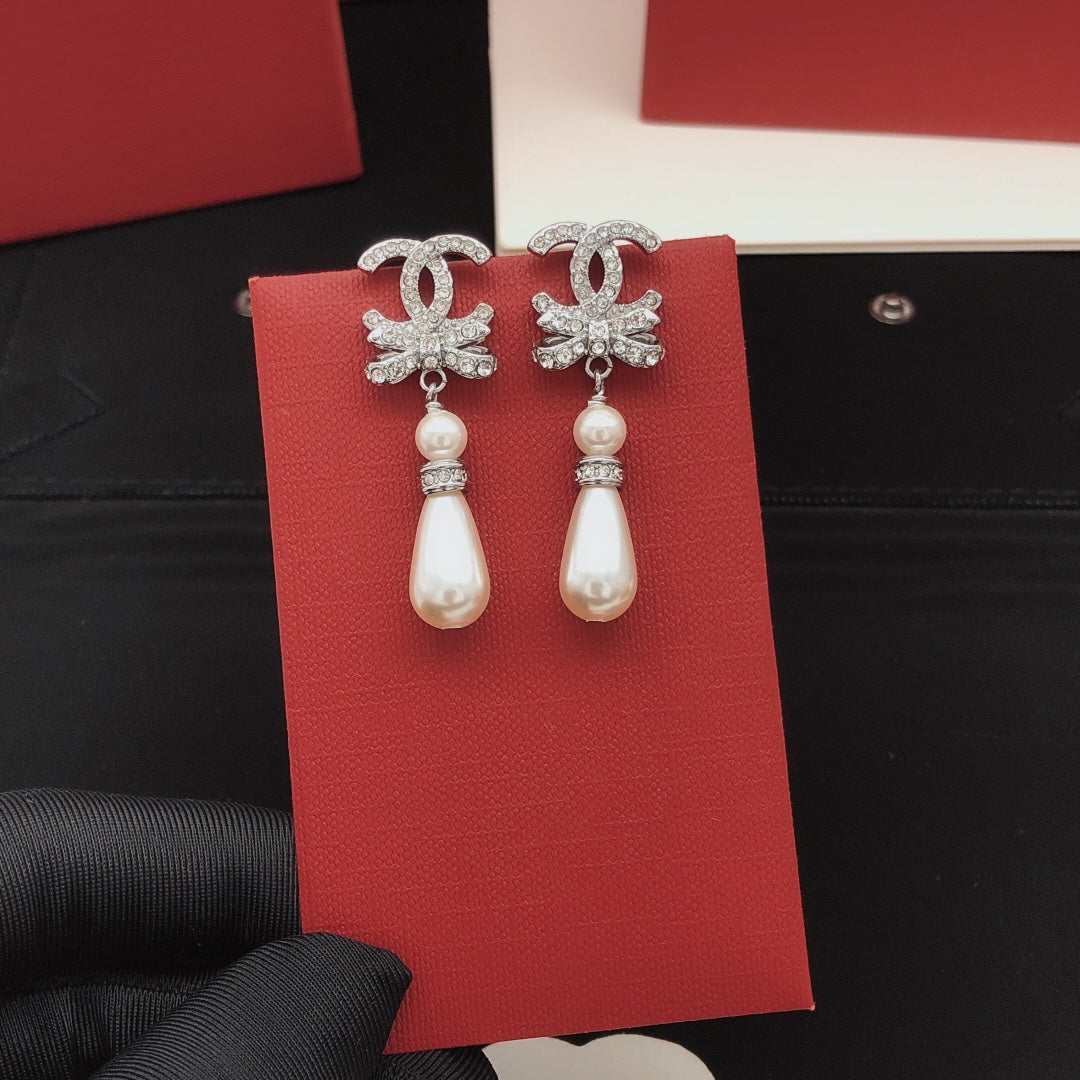Martin Graham stud earrings in polished metal-tone – detail view