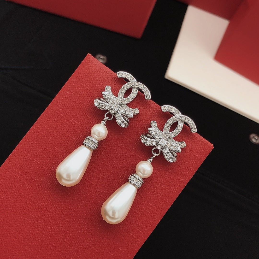 Martin Graham stud earrings in polished metal-tone – front product view