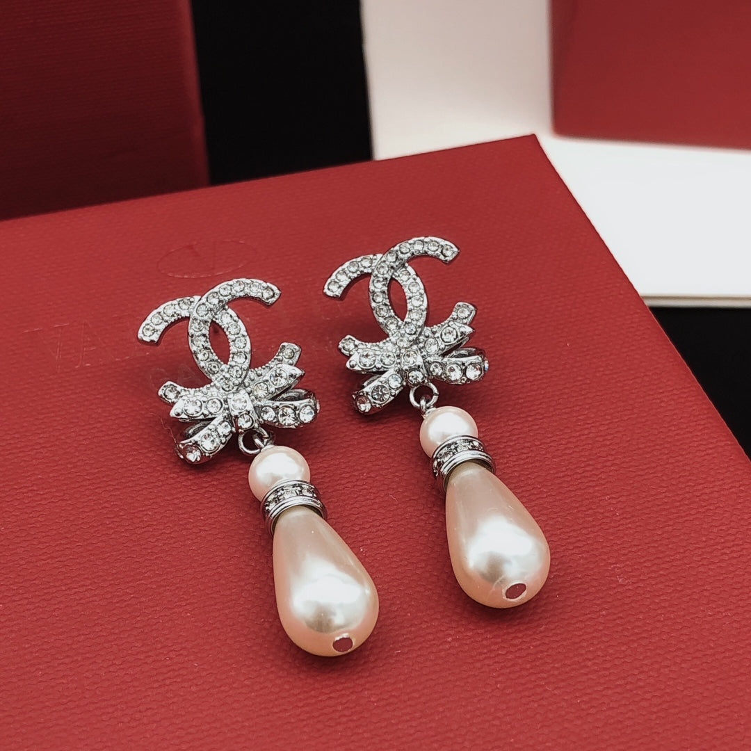 Martin Graham stud earrings in polished metal-tone – side detail