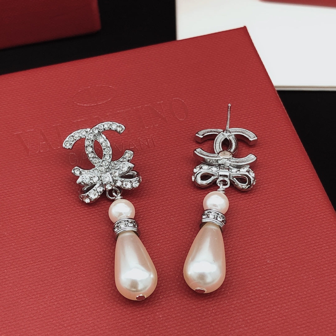 Martin Graham stud earrings in polished metal-tone – front product view