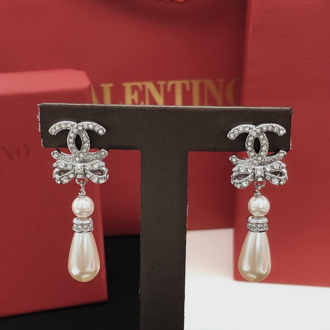 Martin Graham stud earrings in polished metal-tone – detail view