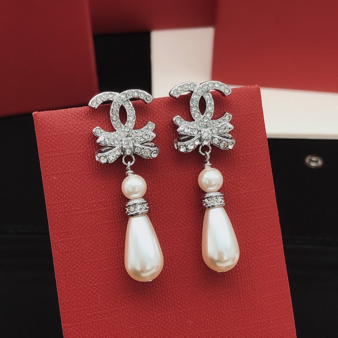 Martin Graham stud earrings in polished metal-tone – side detail
