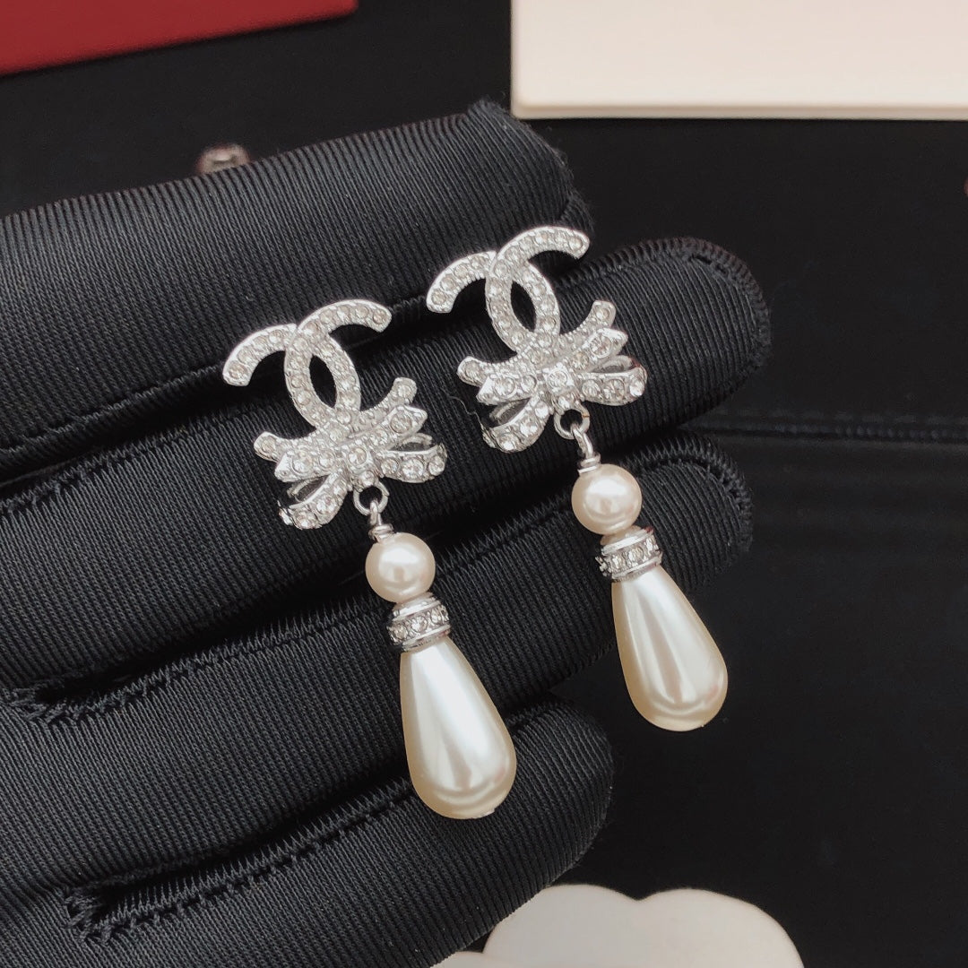 Martin Graham stud earrings in polished metal-tone – styled product view