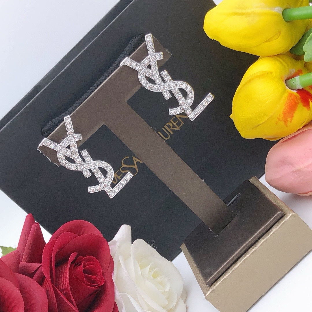 Martin Graham stud earrings in polished metal-tone – detail view