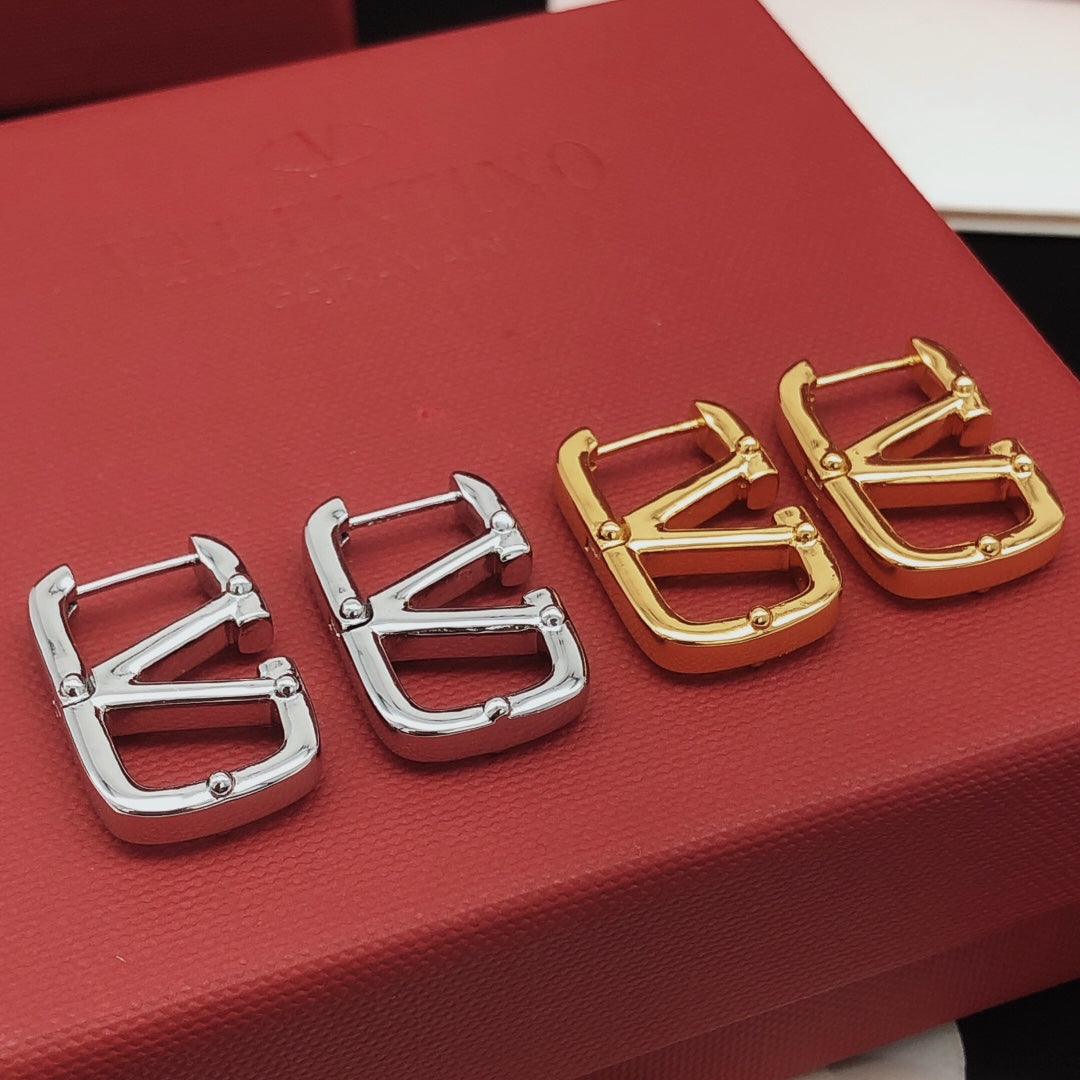 Martin Graham drop earrings in polished metal-tone – side detail