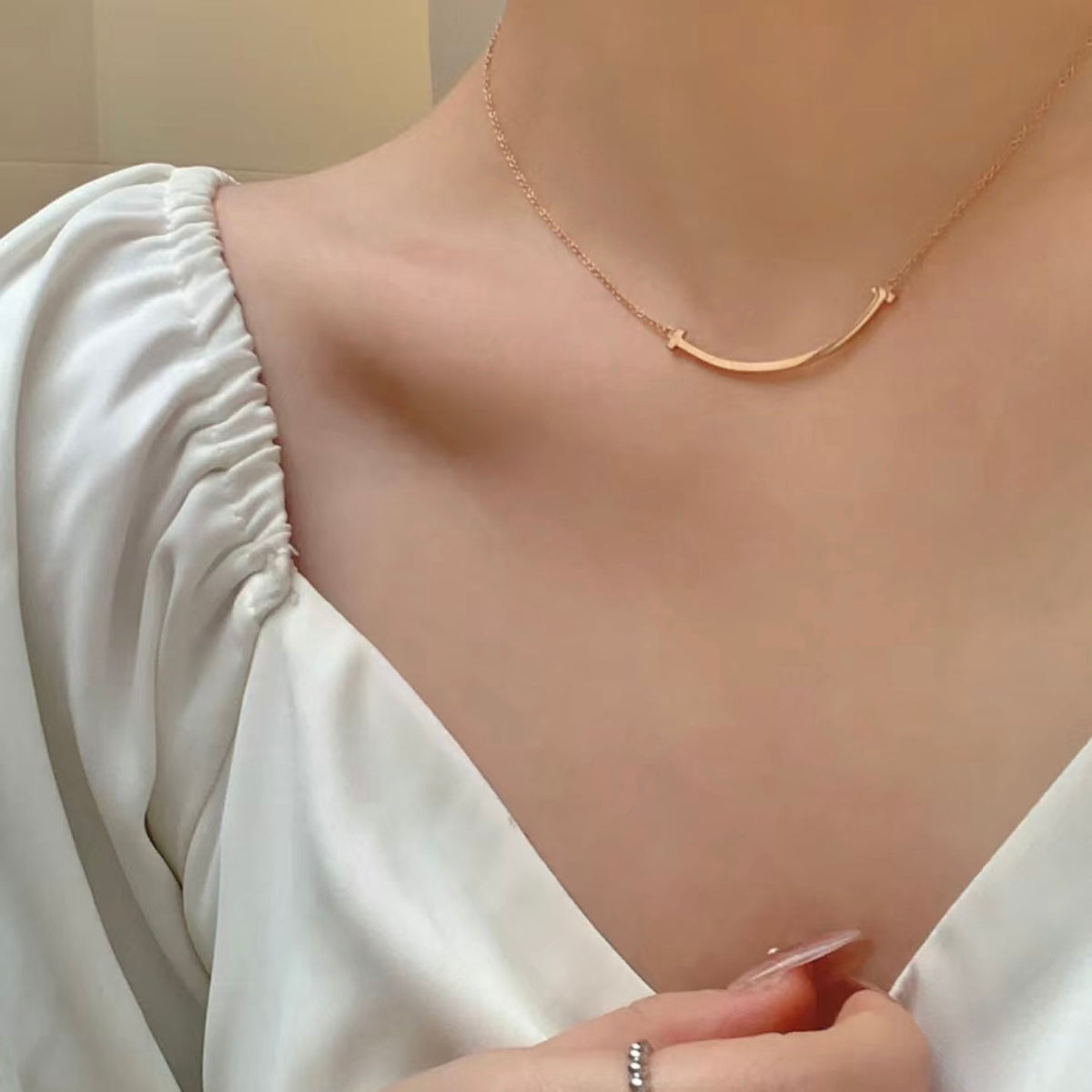 Martin Graham pendant necklace in polished metal-tone – close-up detail