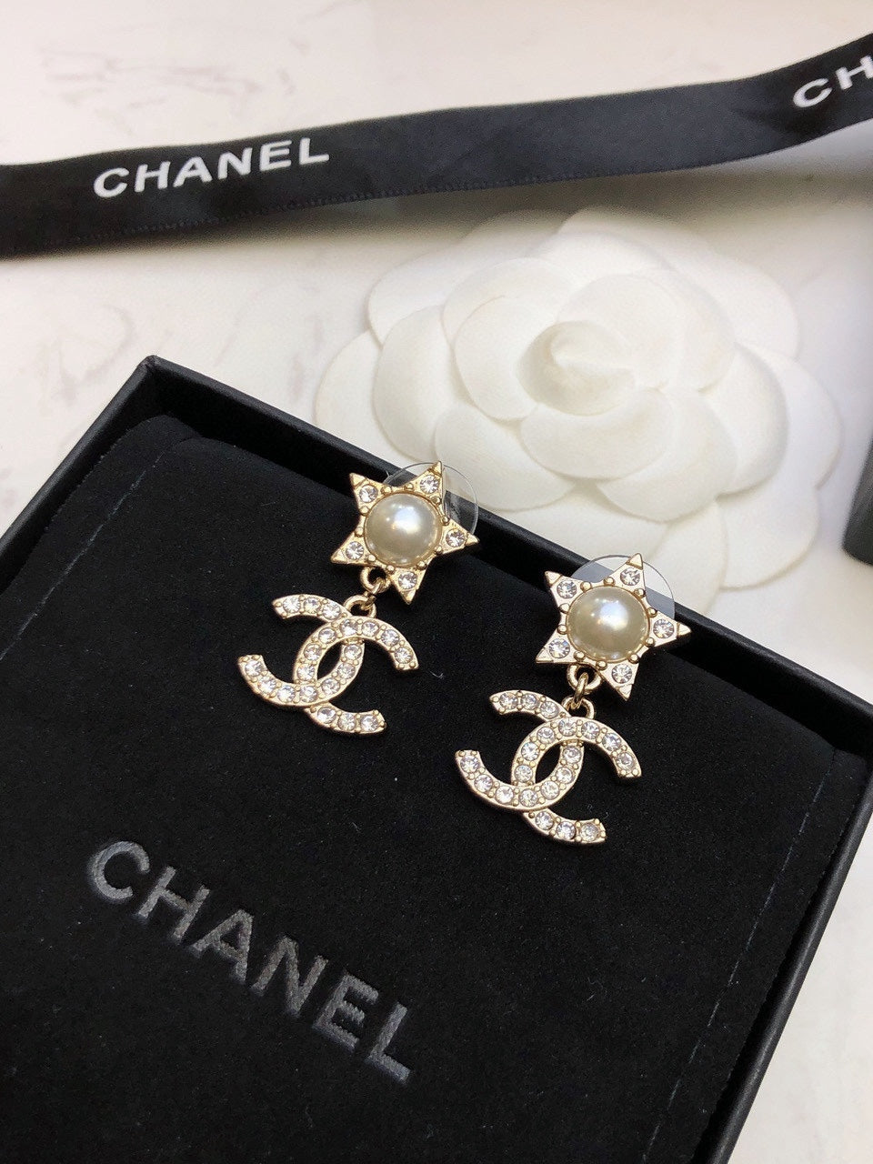 Martin Graham stud earrings in polished metal-tone – detail view