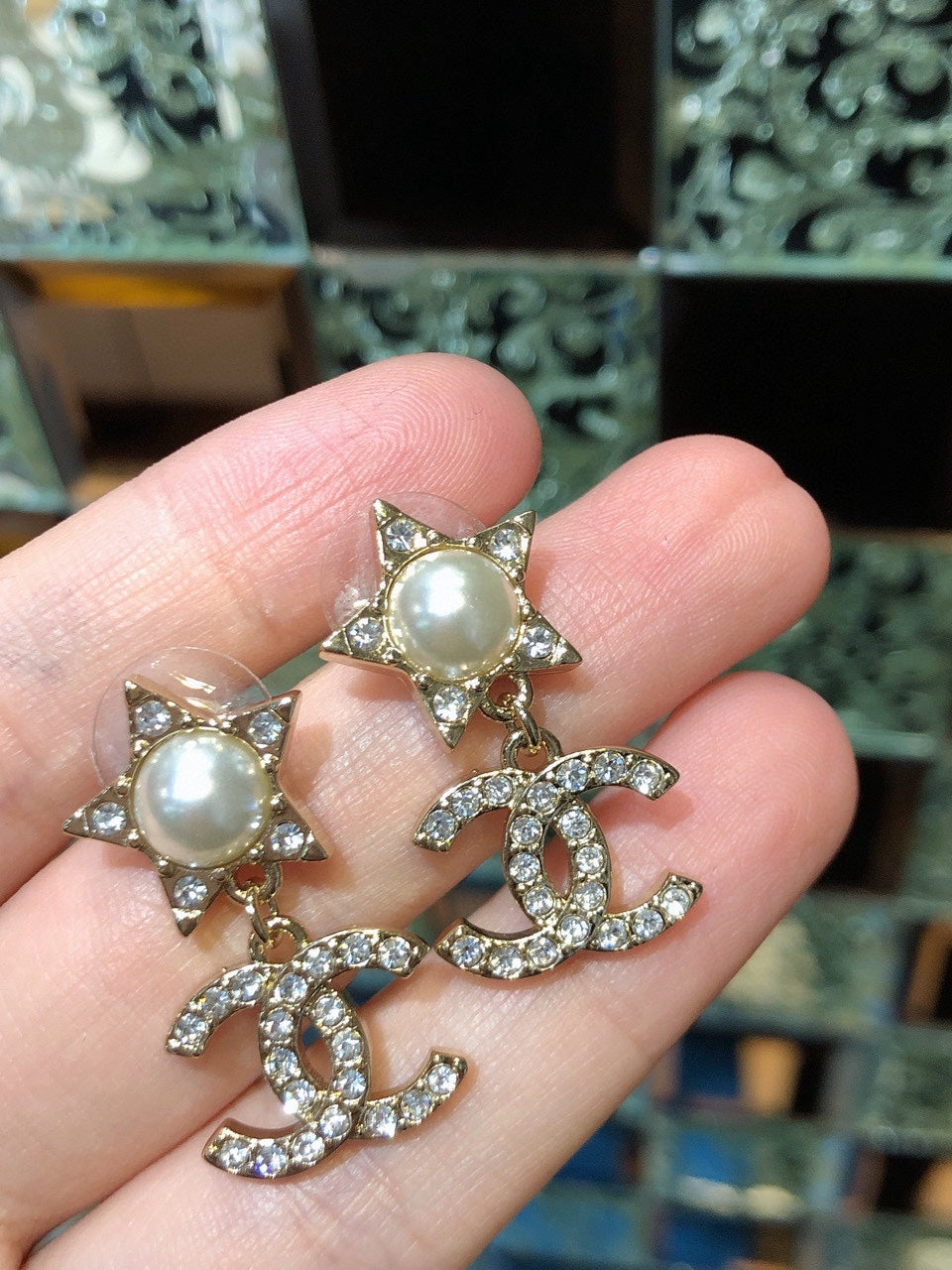 Martin Graham stud earrings in polished metal-tone – front product view