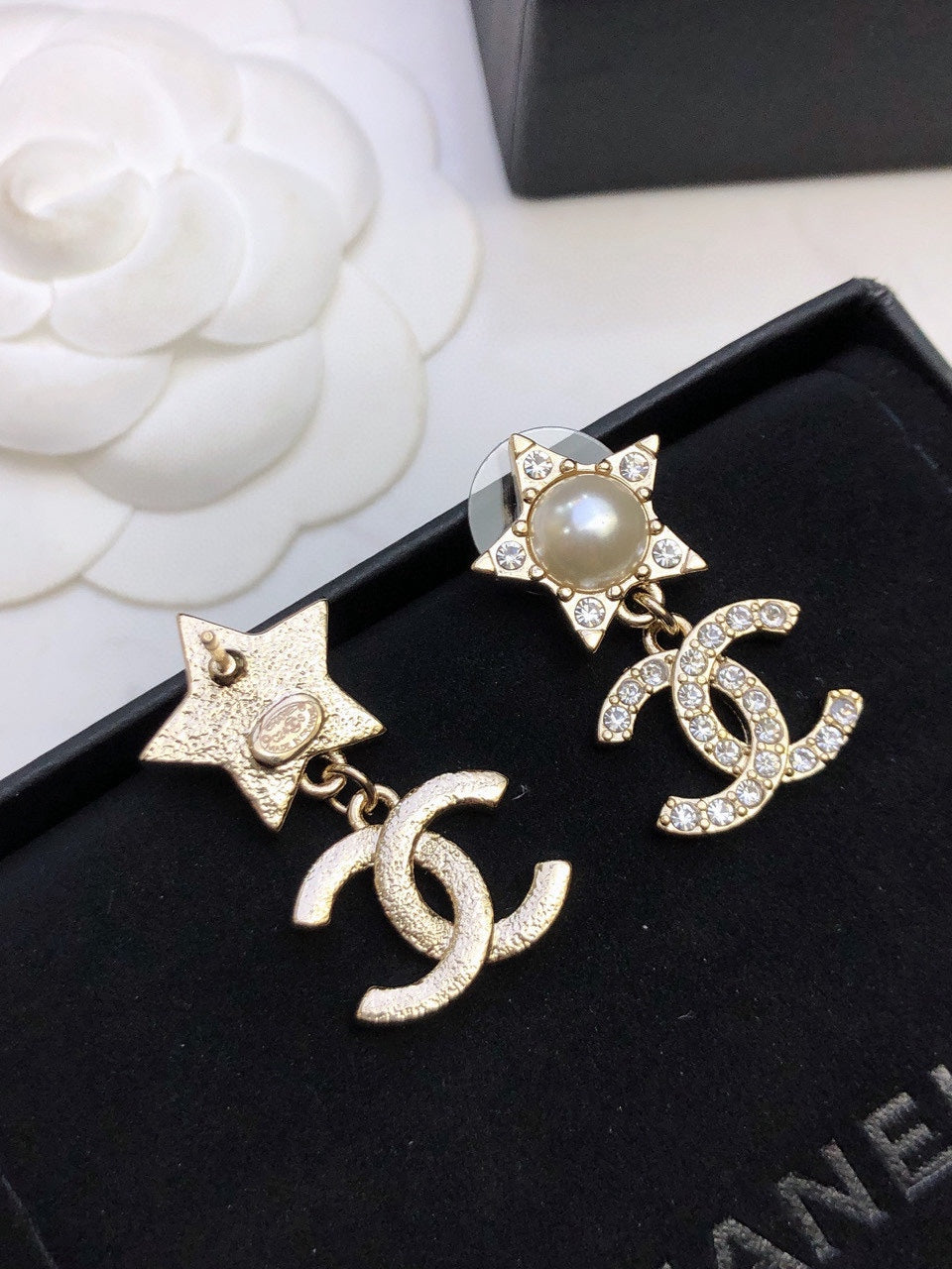 Martin Graham stud earrings in polished metal-tone – side detail