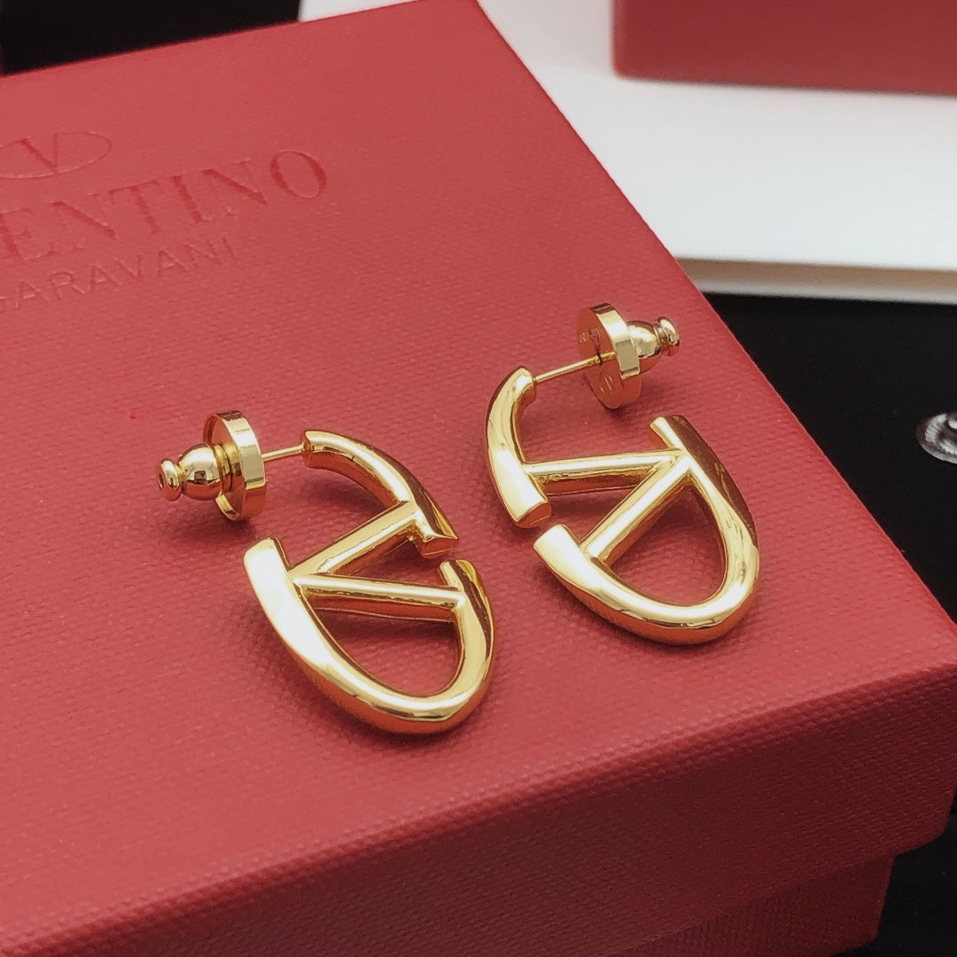 Martin Graham stud earrings in polished metal-tone