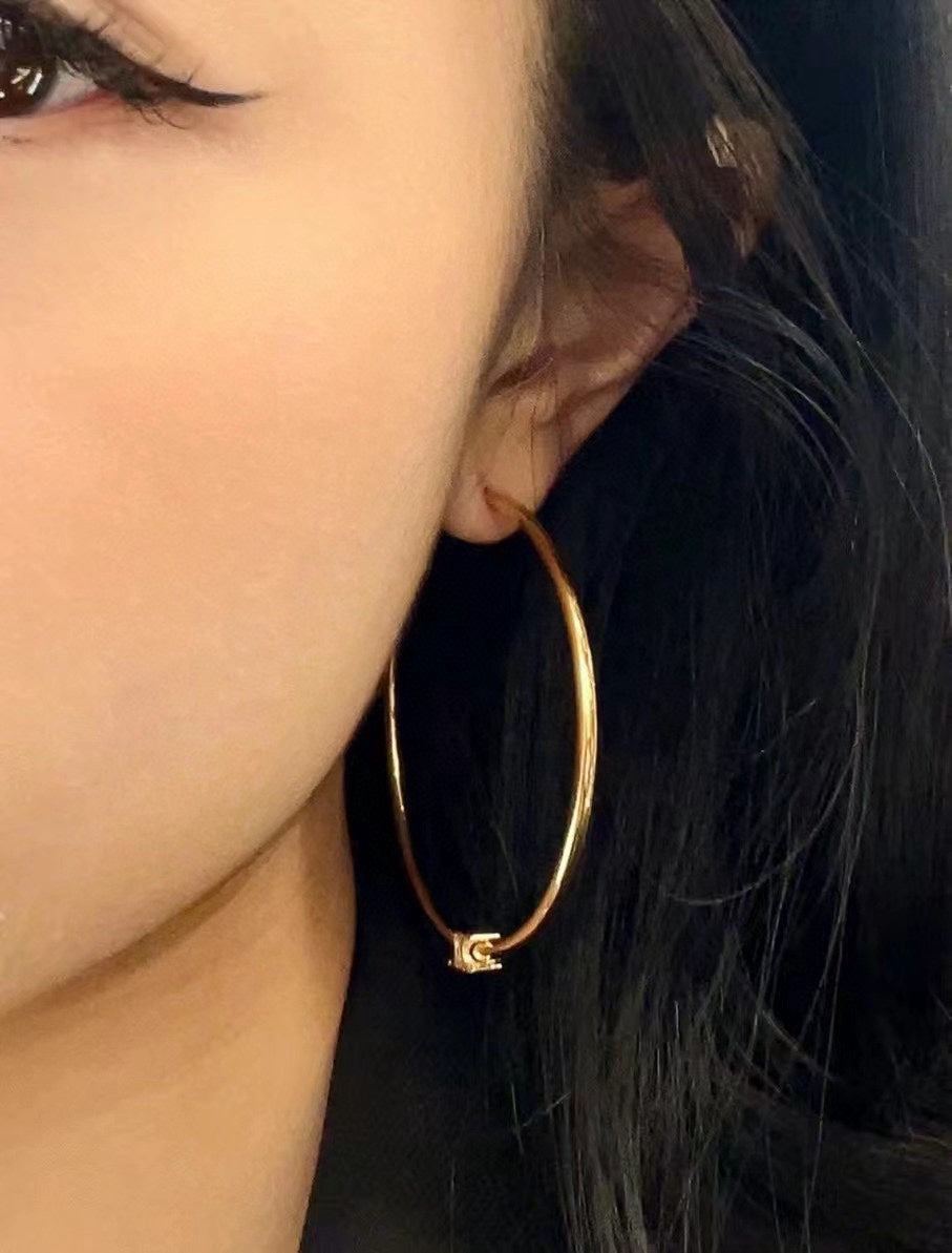 Martin Graham earrings in polished metal-tone – front view