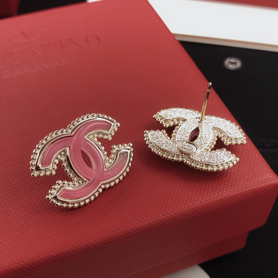 Martin Graham stud earrings in polished metal-tone – detail view
