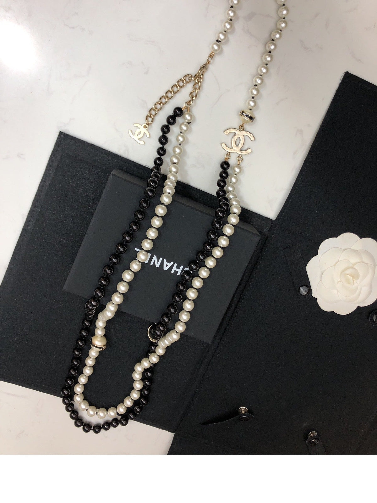 Martin Graham pendant necklace in polished metal-tone – side detail