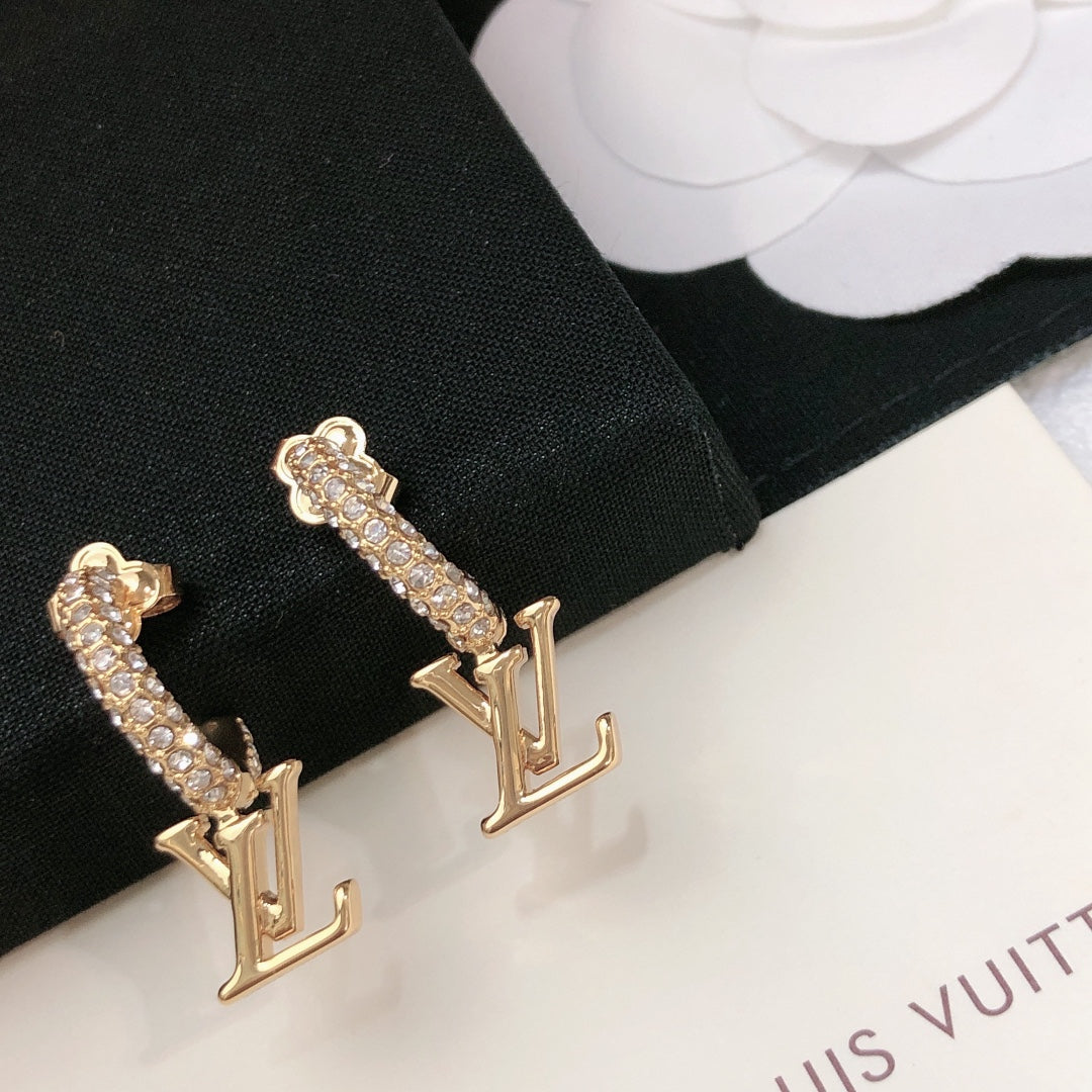 Martin Graham stud earrings in polished metal-tone – styled product view