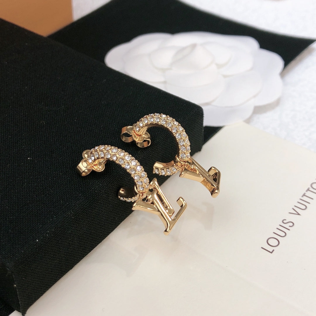 Martin Graham stud earrings in polished metal-tone – detail view