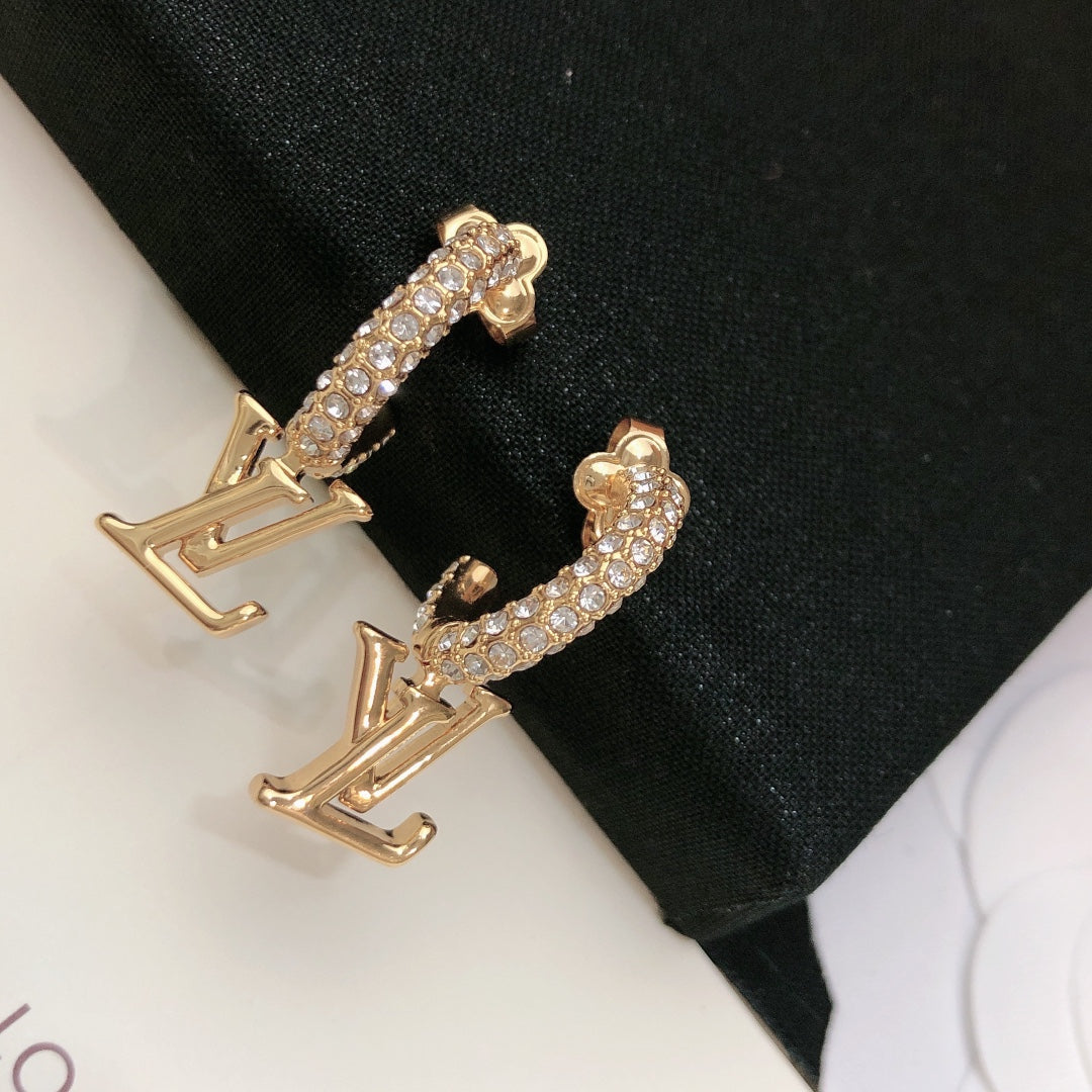 Martin Graham stud earrings in polished metal-tone – side detail