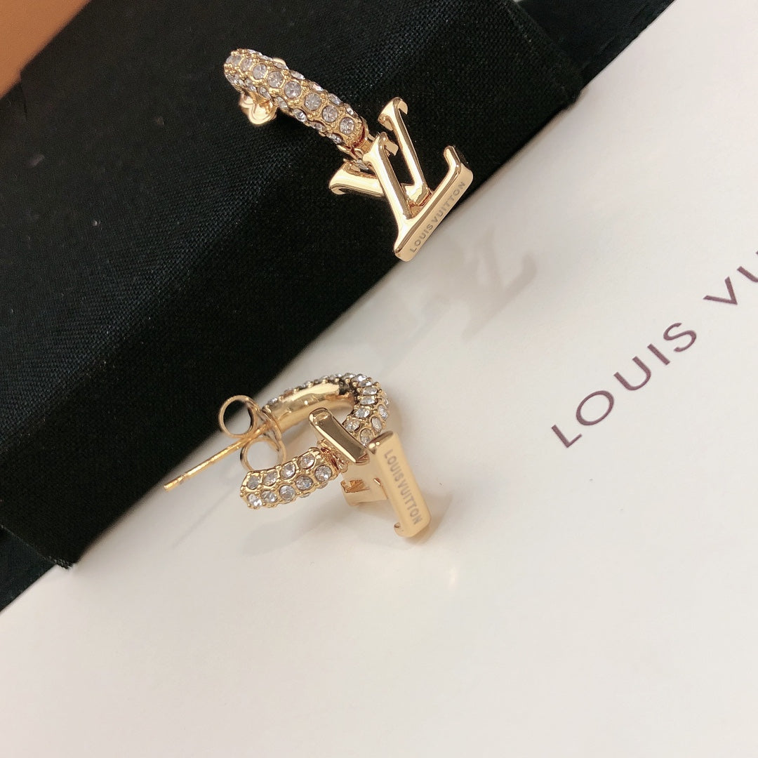 Martin Graham stud earrings in polished metal-tone – detail view