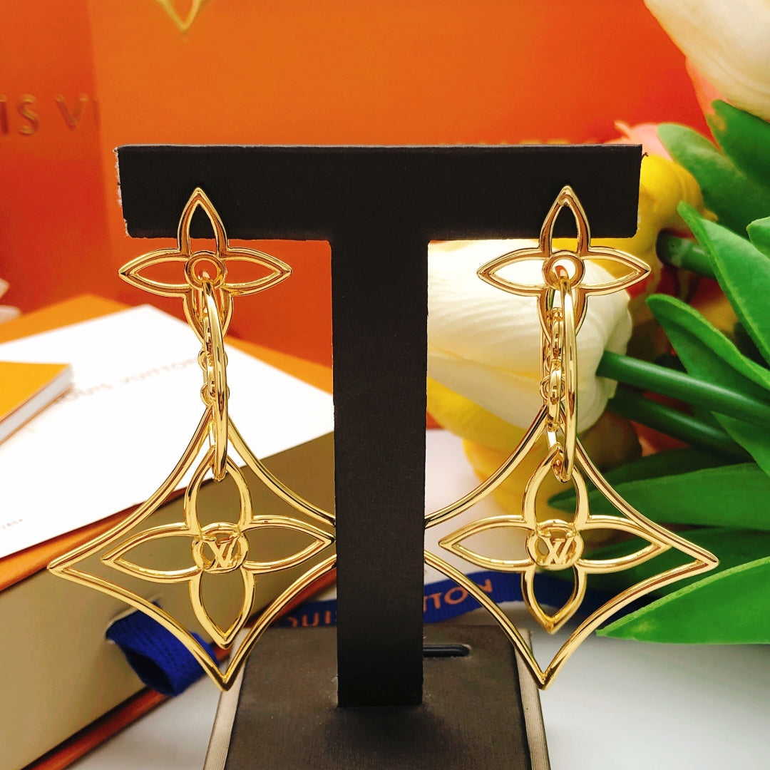 Martin Graham stud earrings in polished metal-tone – close-up detail