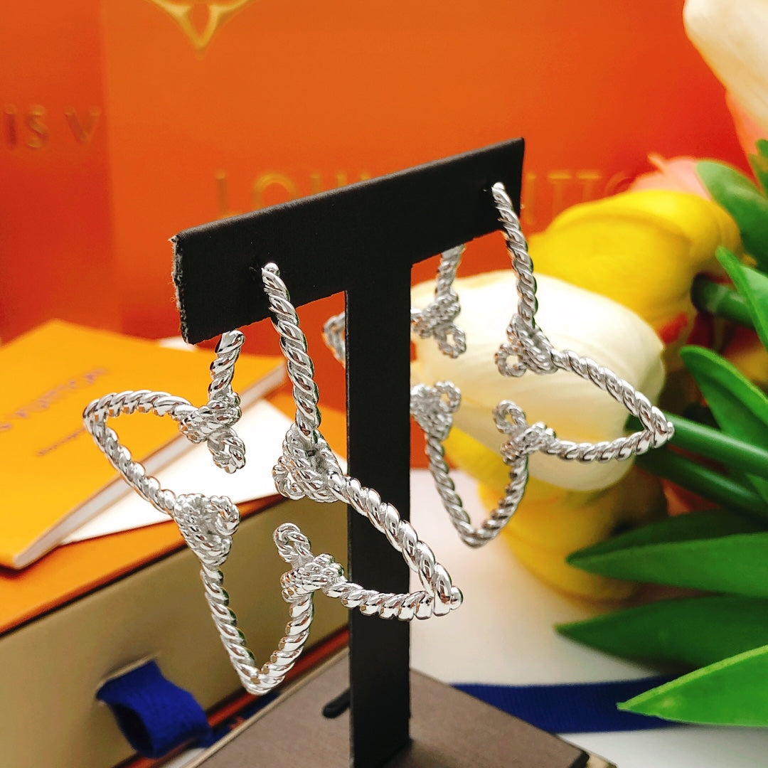 Martin Graham stud earrings in polished metal-tone – styled product view