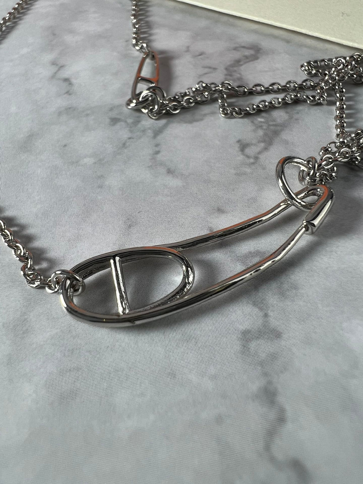 Martin Graham pendant necklace in polished metal-tone – side detail