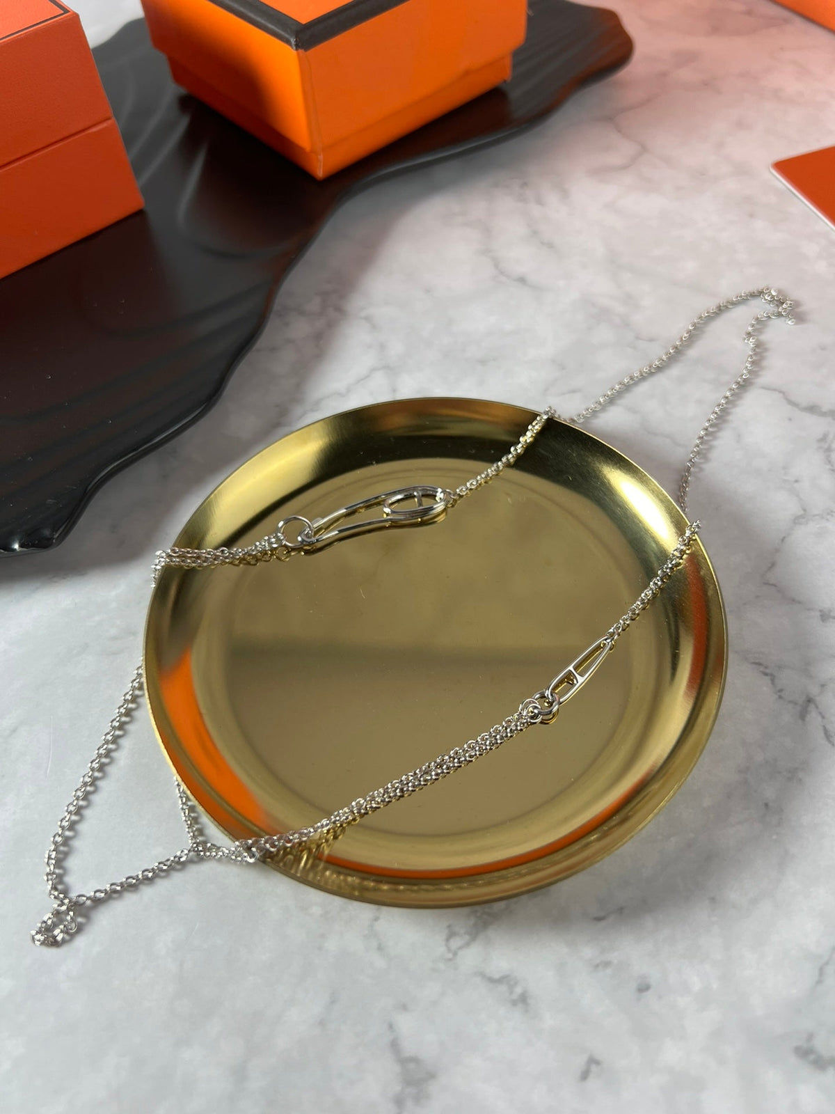 Martin Graham pendant necklace in polished metal-tone – close-up detail