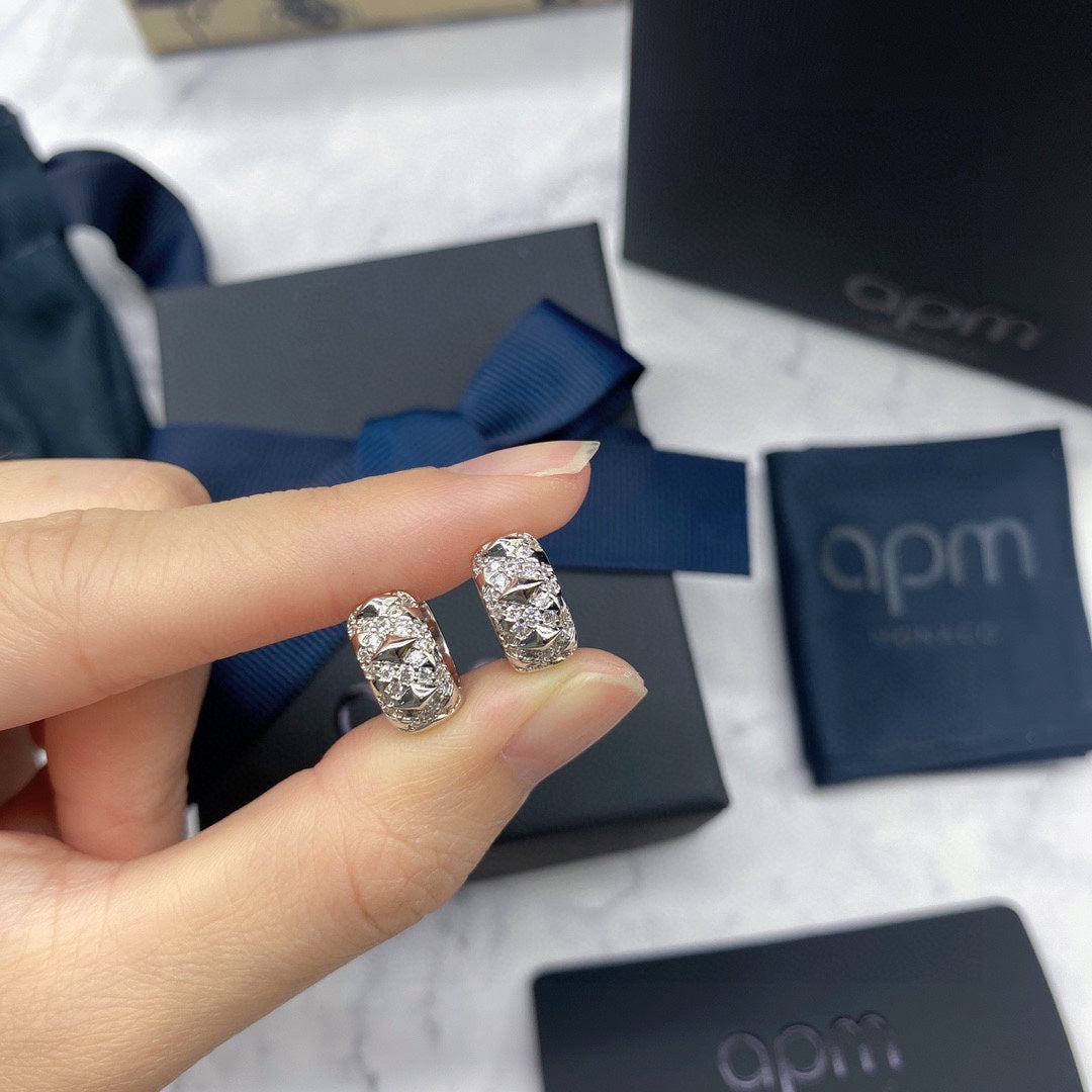 Martin Graham earrings in polished metal-tone – close-up detail