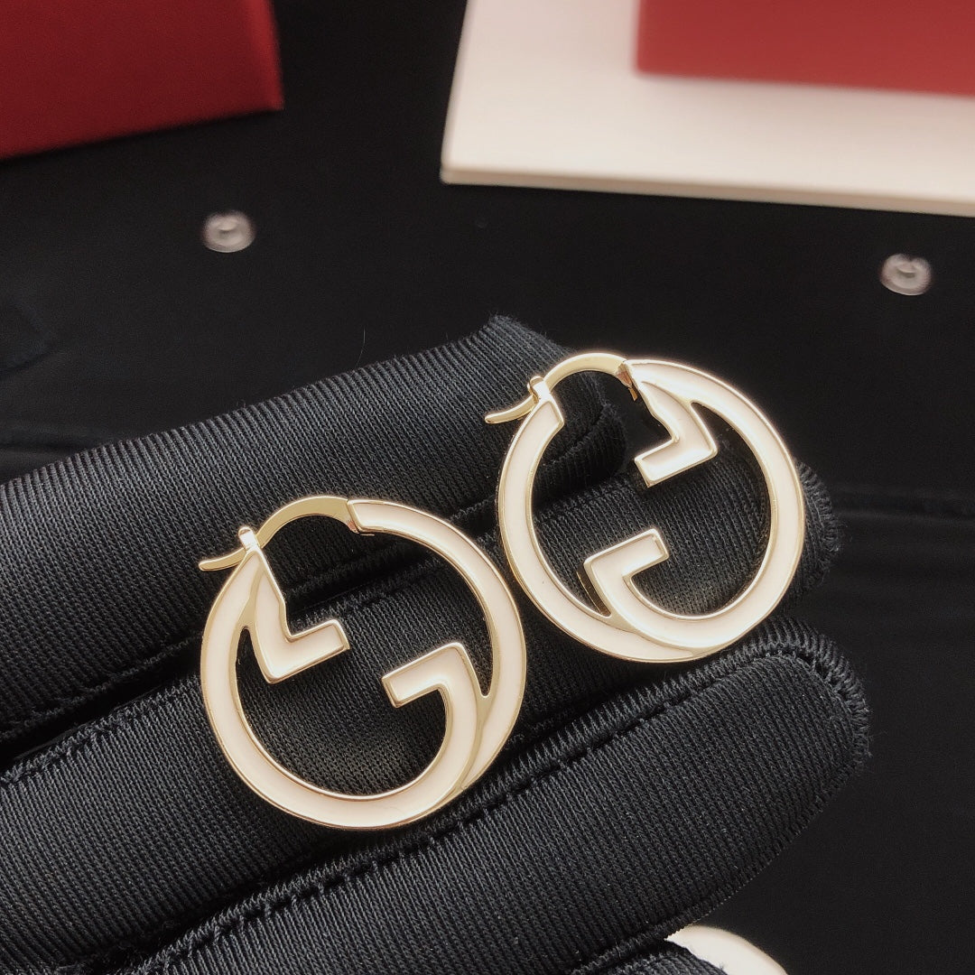 Martin Graham earrings in polished metal-tone – styled product view