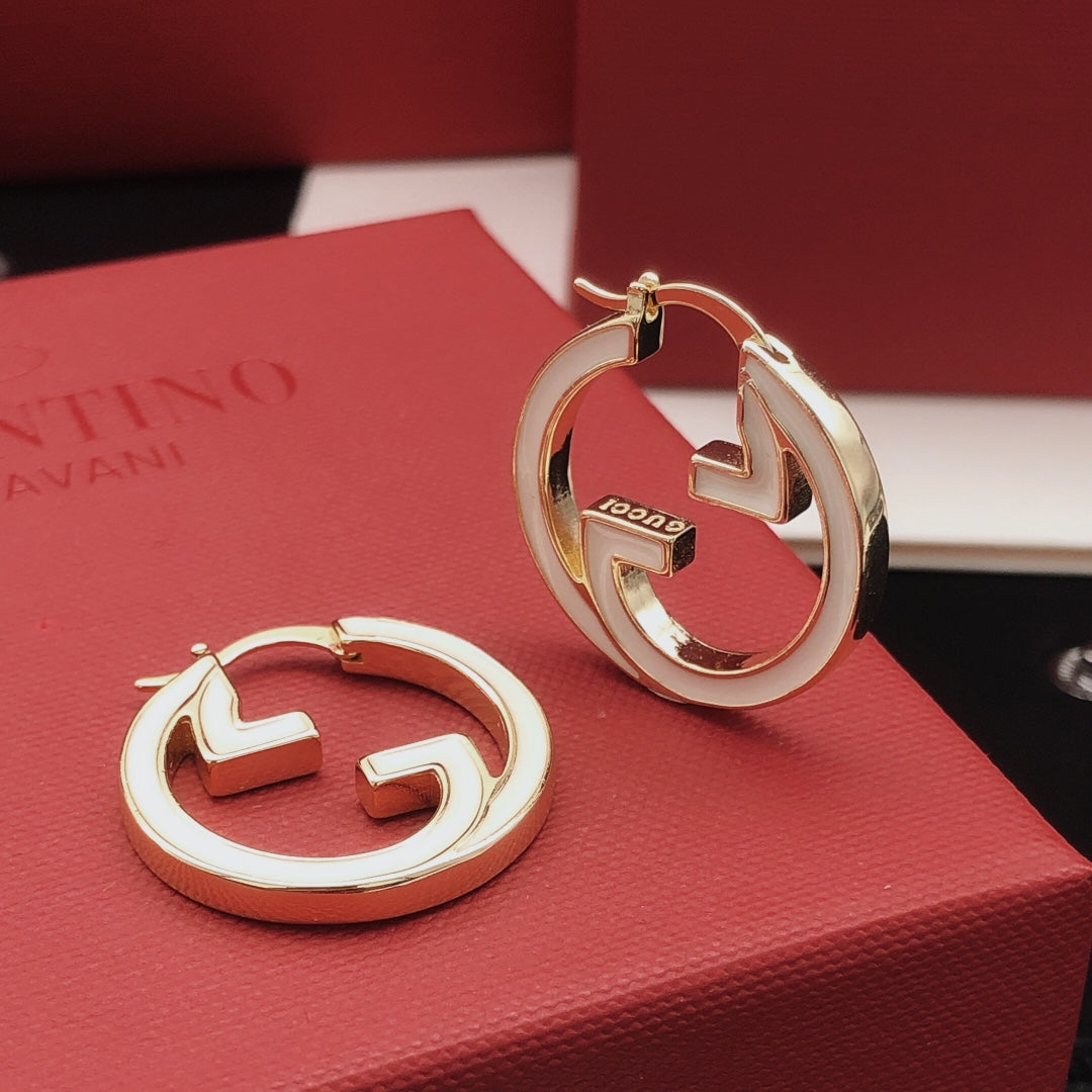 Martin Graham earrings in polished metal-tone – front product view
