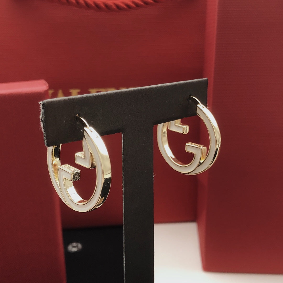 Martin Graham earrings in polished metal-tone – front product view