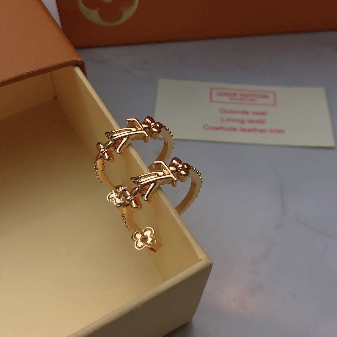 Martin Graham stud earrings in polished metal-tone – front product view