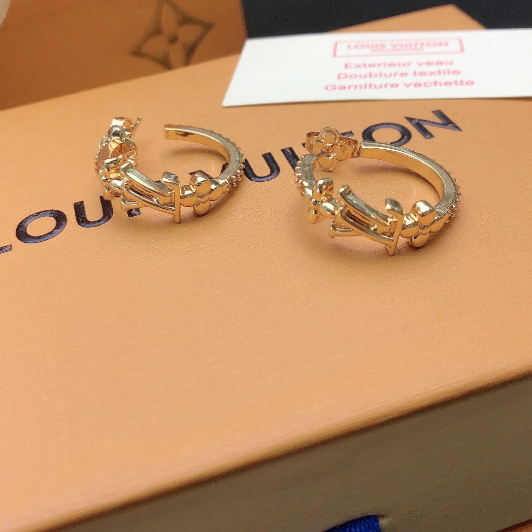 Martin Graham stud earrings in polished metal-tone – styled product view