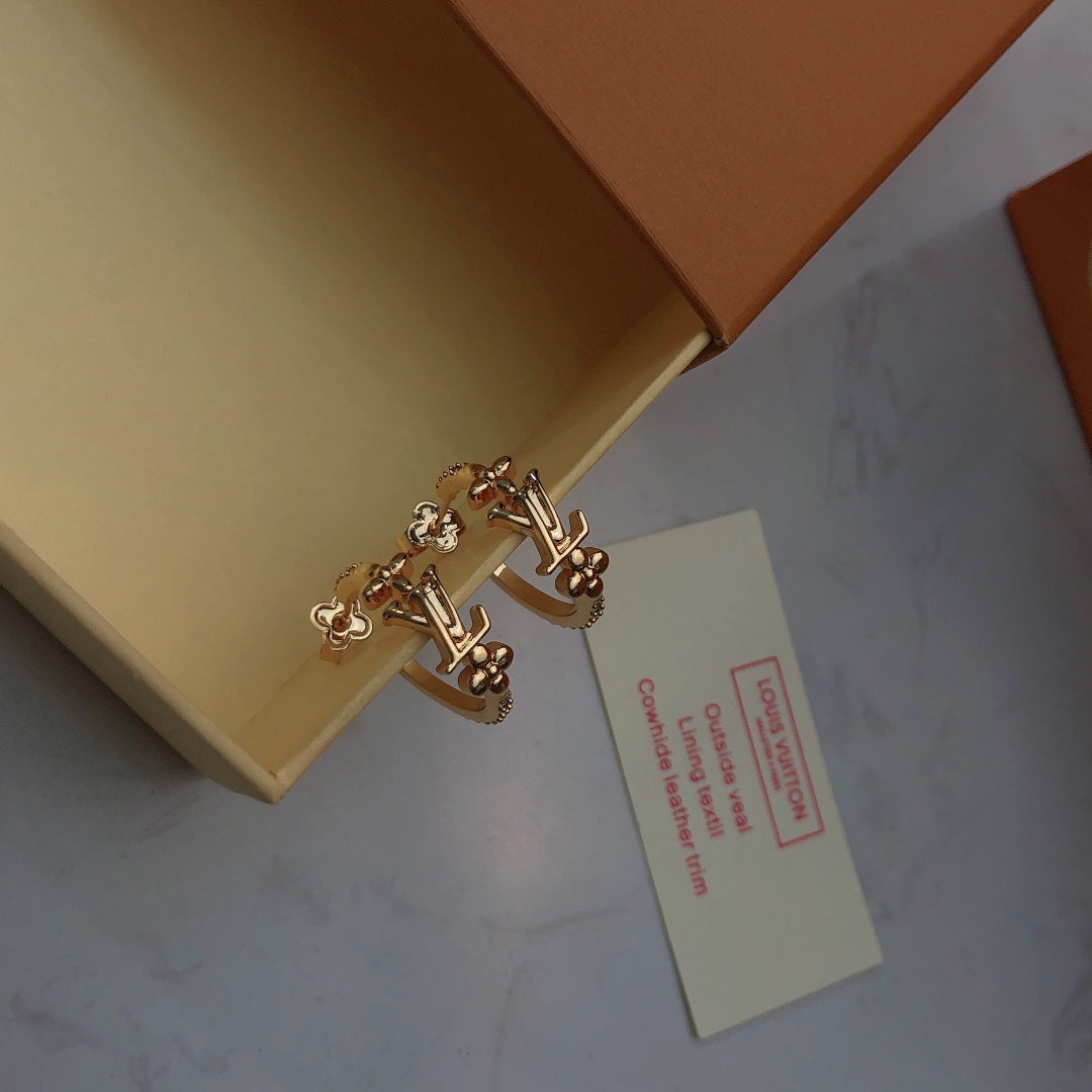 Martin Graham stud earrings in polished metal-tone – front product view