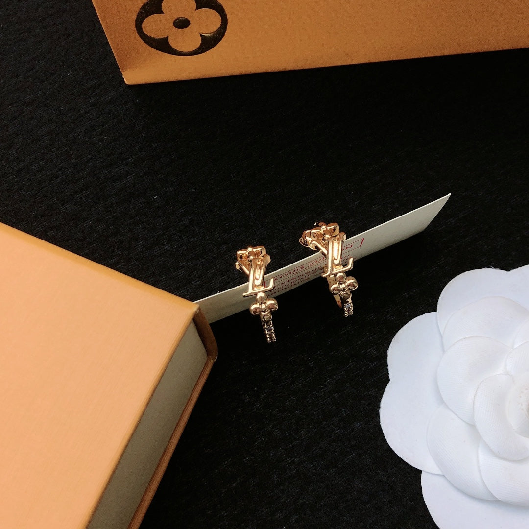 Martin Graham stud earrings in polished metal-tone – detail view
