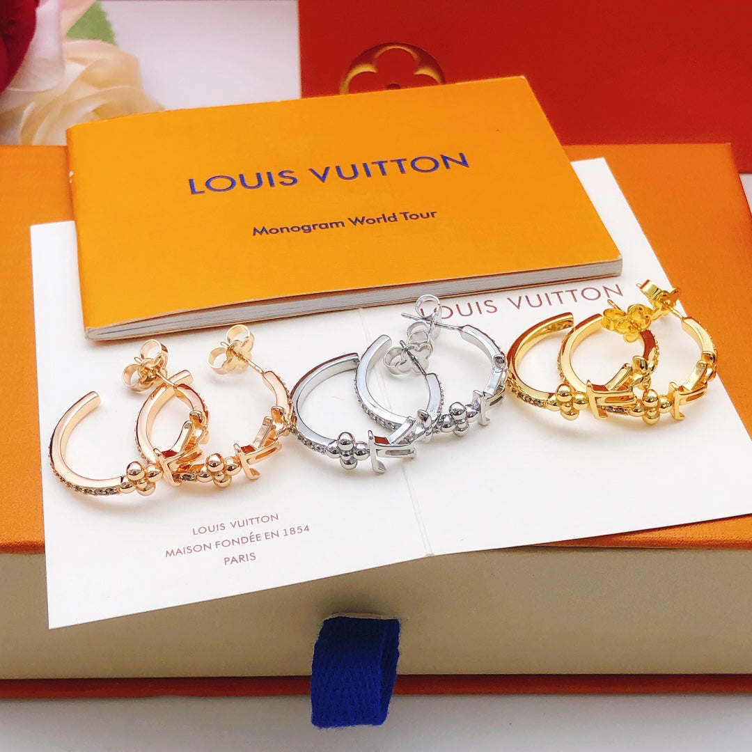 Martin Graham earrings in polished metal-tone – front product view