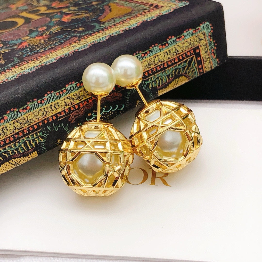Martin Graham stud earrings in polished metal-tone – close-up detail