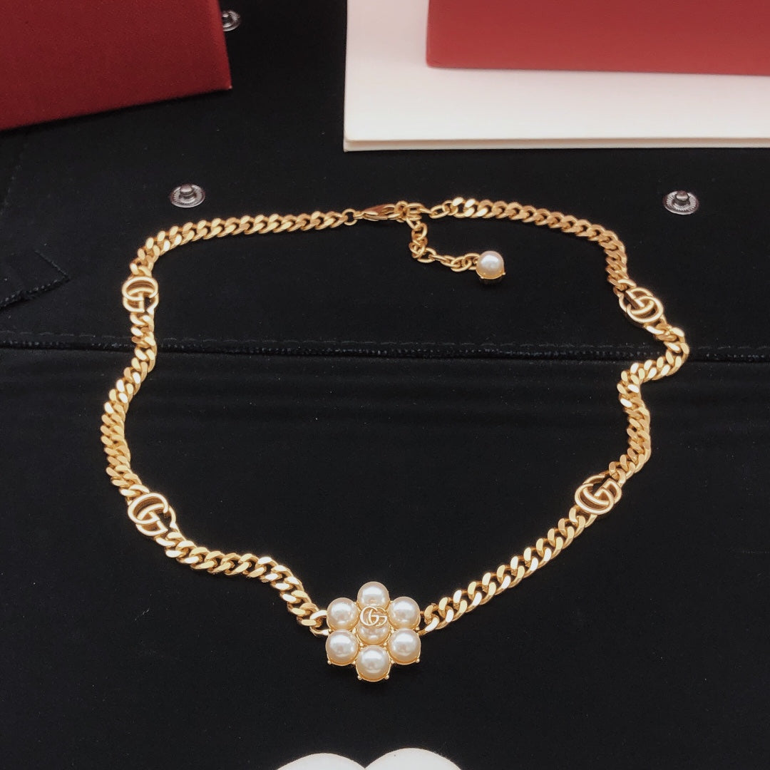 Martin Graham pendant necklace in polished metal-tone – close-up detail