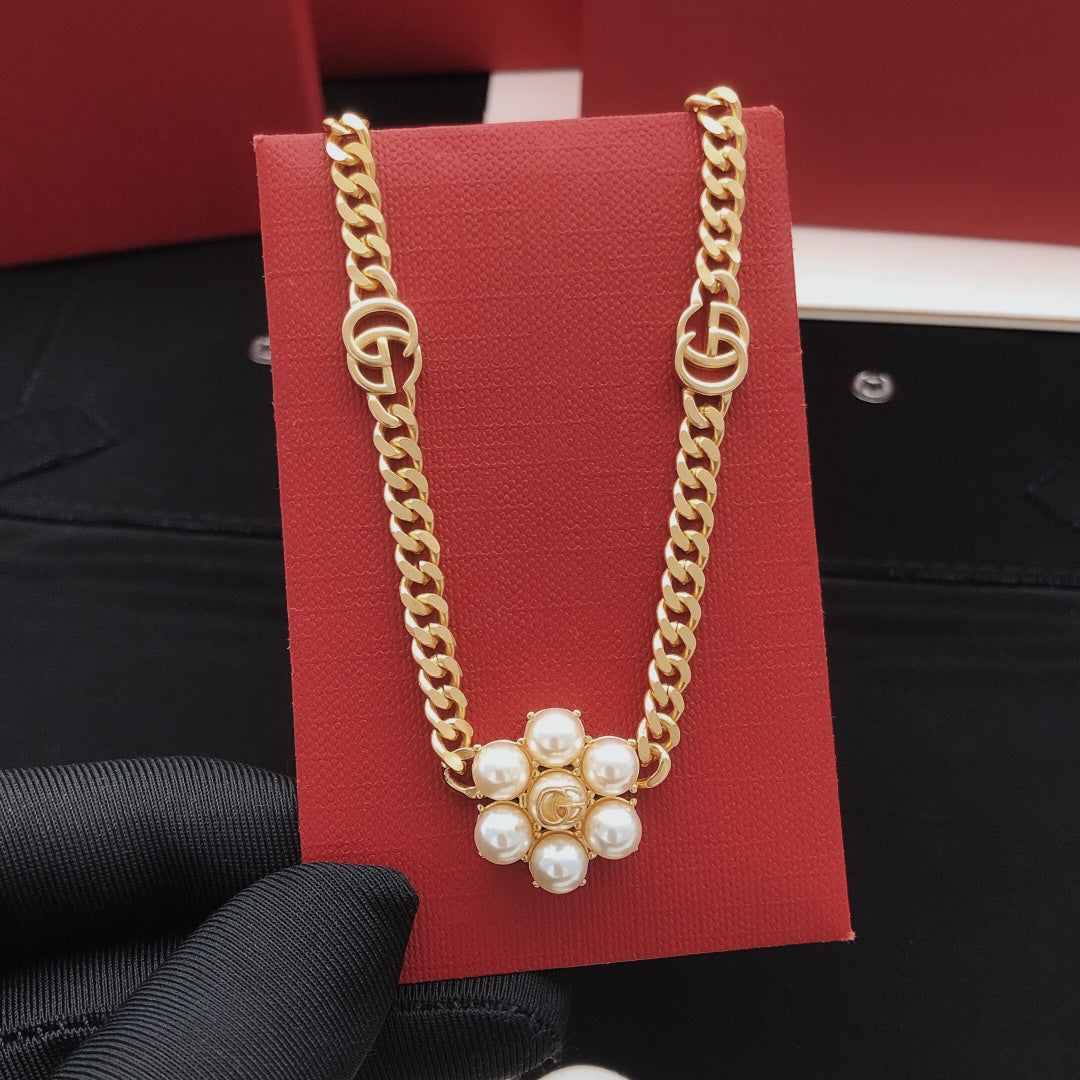 Martin Graham pendant necklace in polished metal-tone – detail view