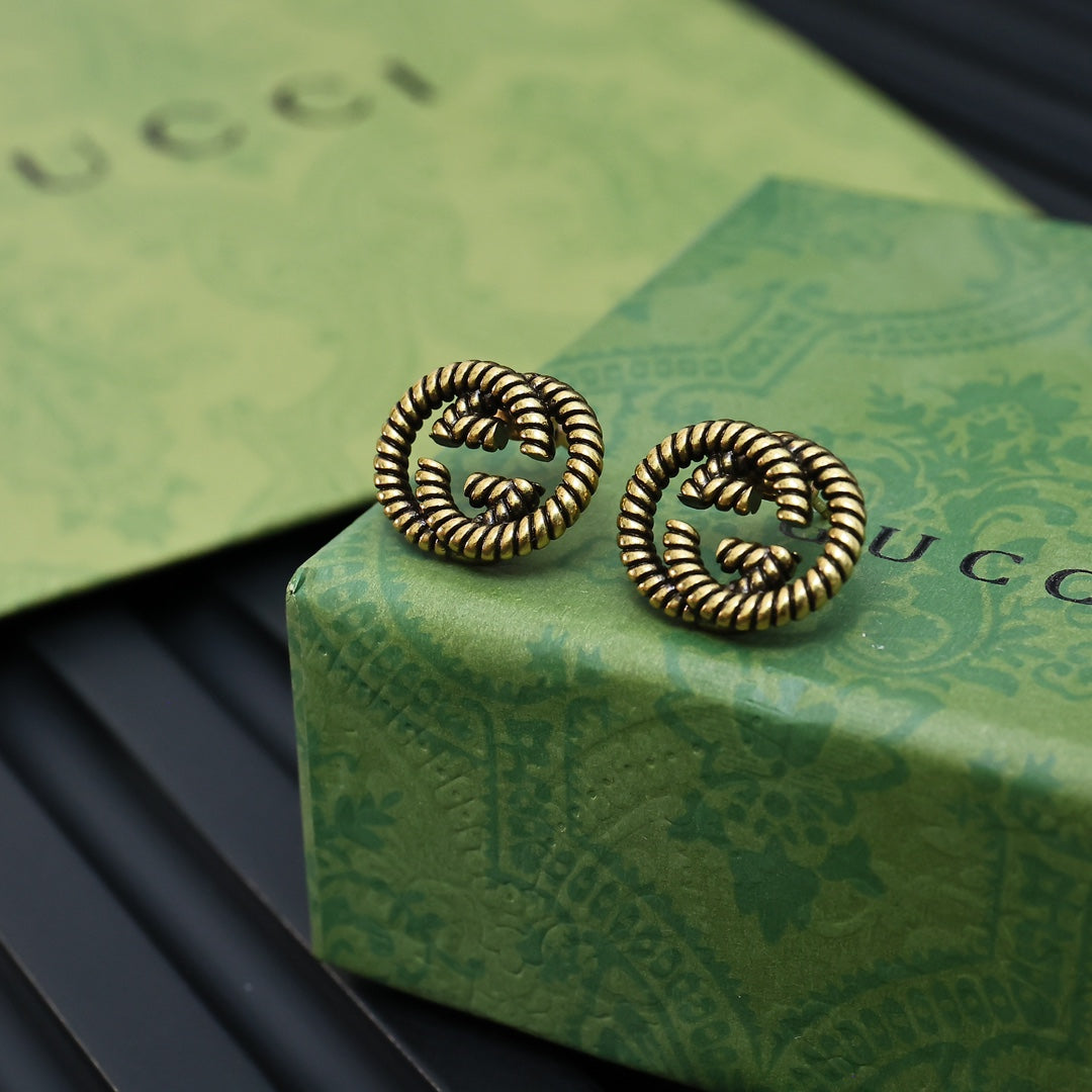 Martin Graham stud earrings in polished metal-tone – main product view