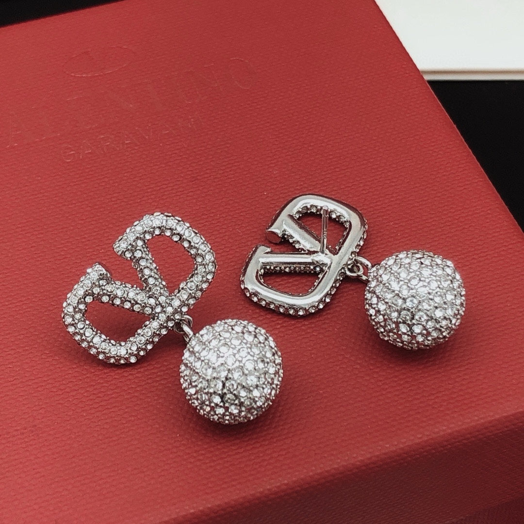 Martin Graham stud earrings in polished metal-tone – front view