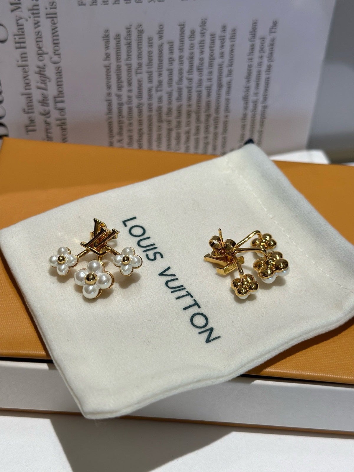 Martin Graham earrings in polished metal-tone – close-up detail