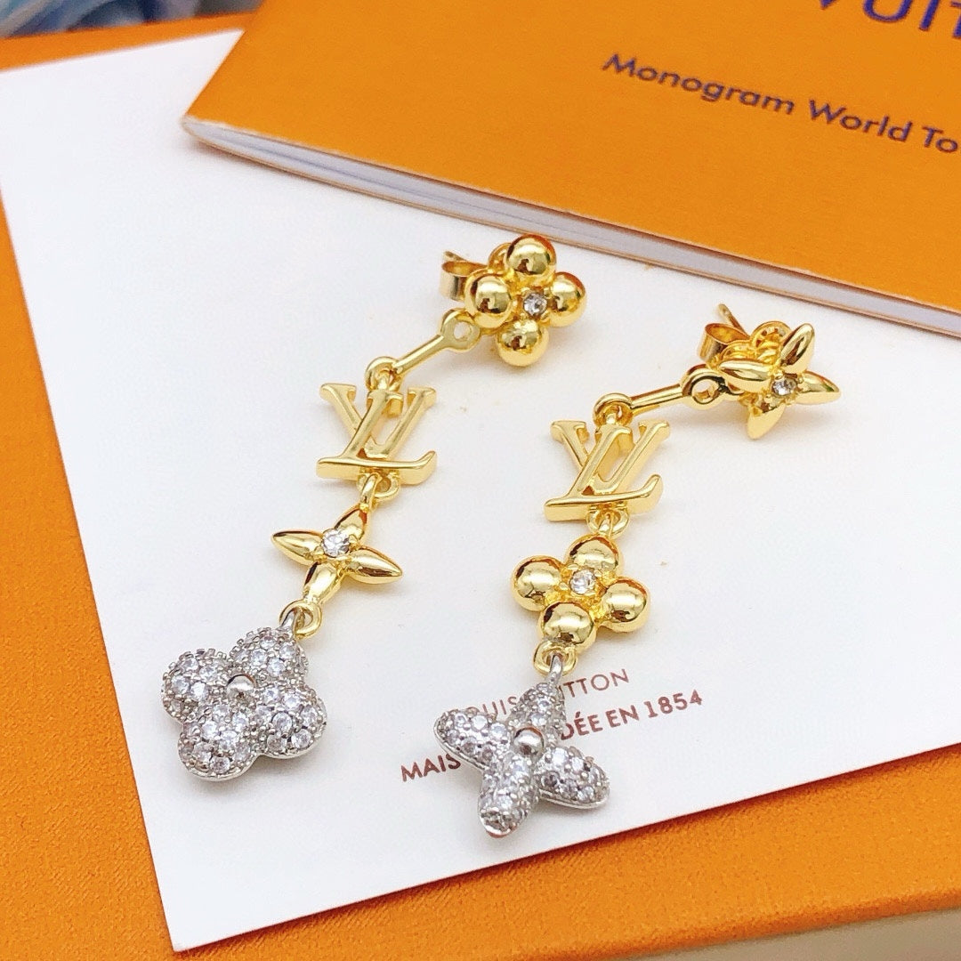 Martin Graham stud earrings in polished metal-tone – close-up detail