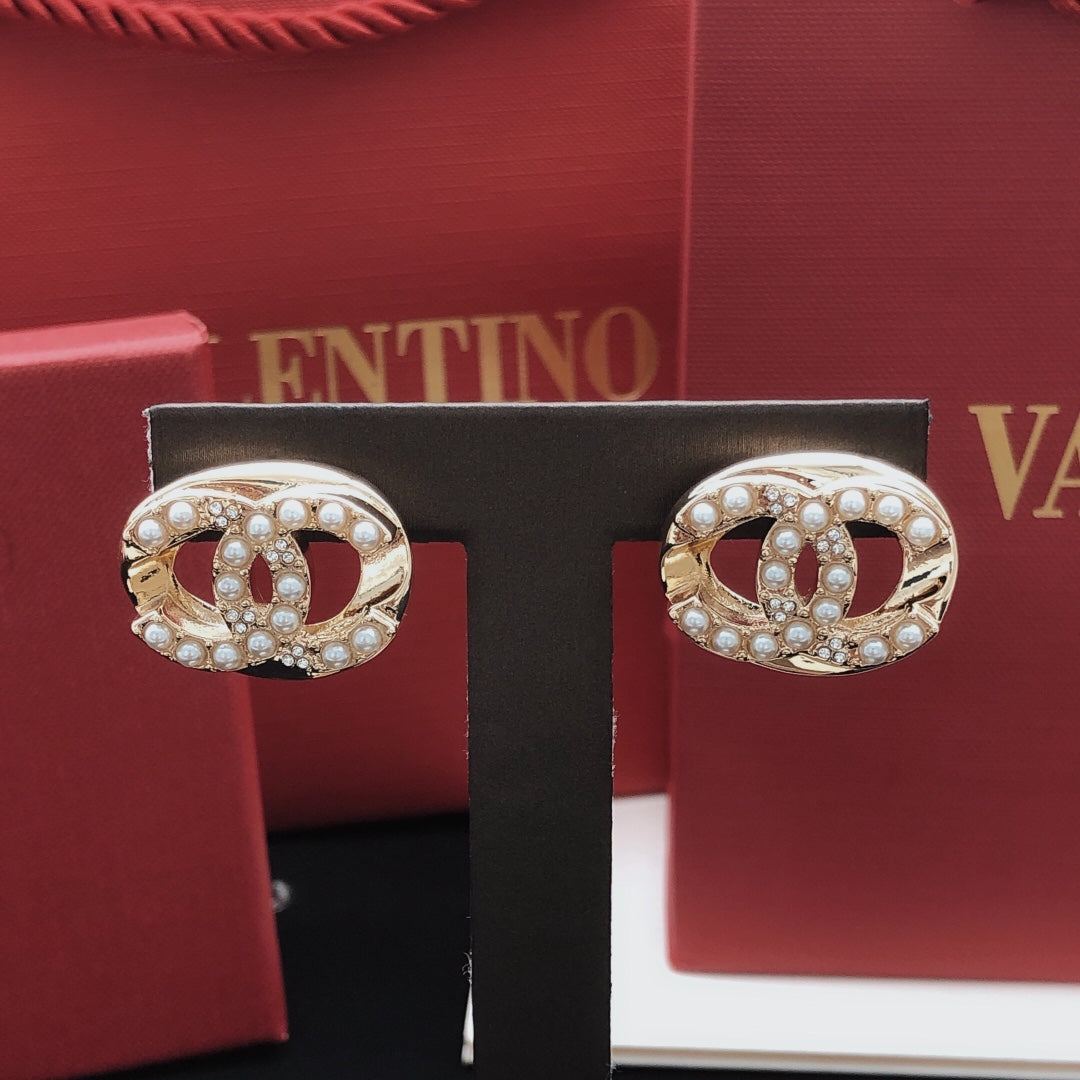 Martin Graham stud earrings in polished metal-tone – main product view