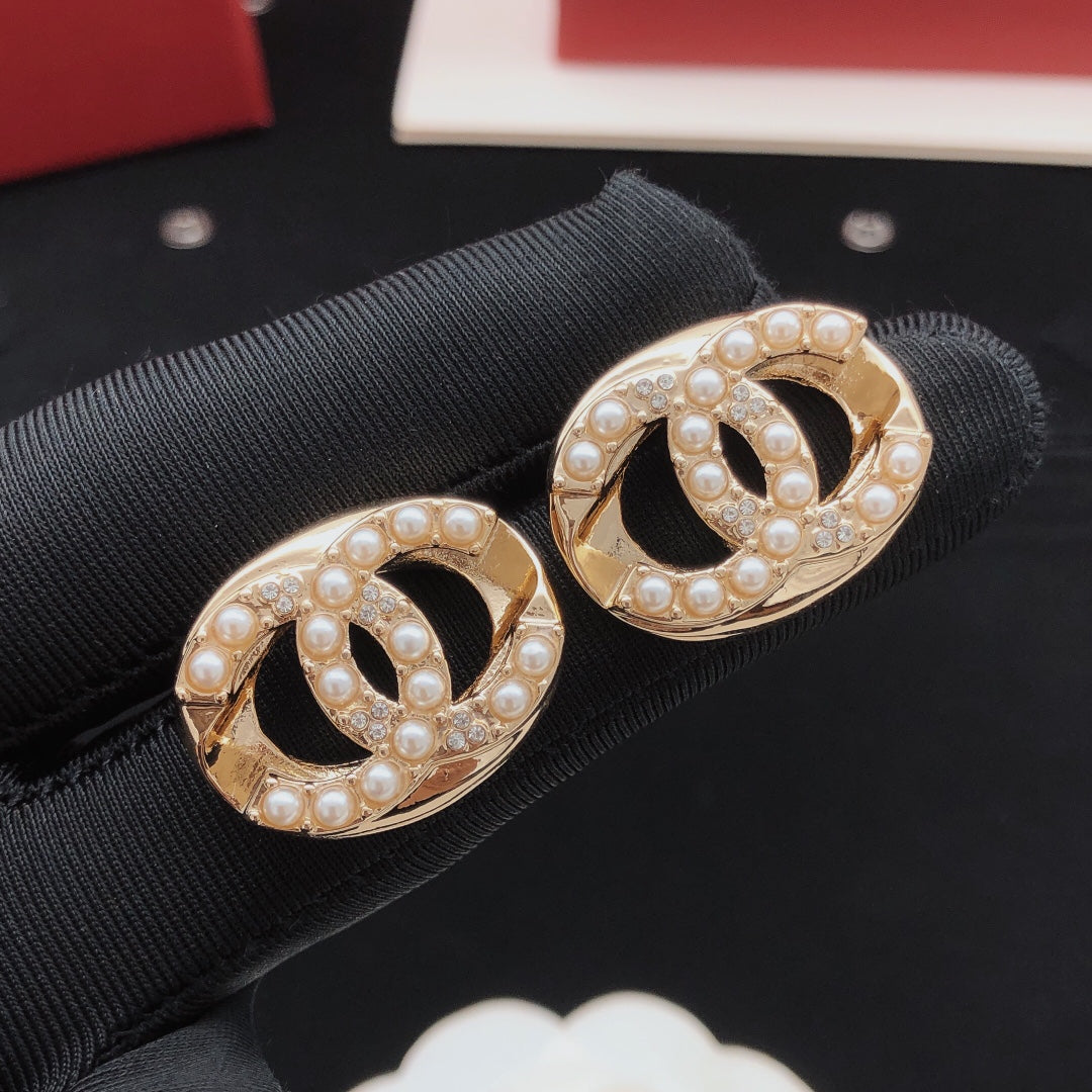 Martin Graham stud earrings in polished metal-tone – front product view