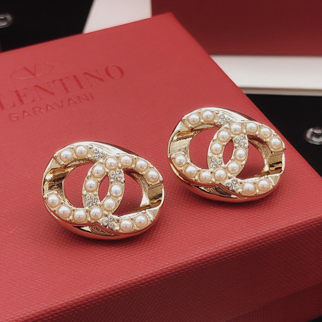 Martin Graham stud earrings in polished metal-tone – side detail